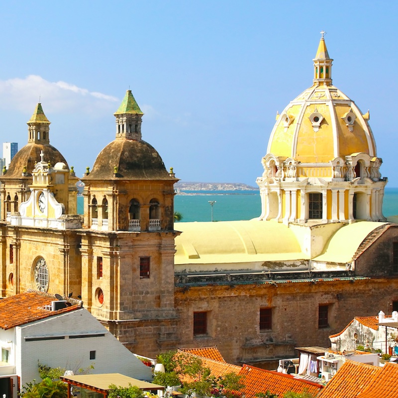 colonial architecture and sea in the background on a sunny day in Cartagena Colombia