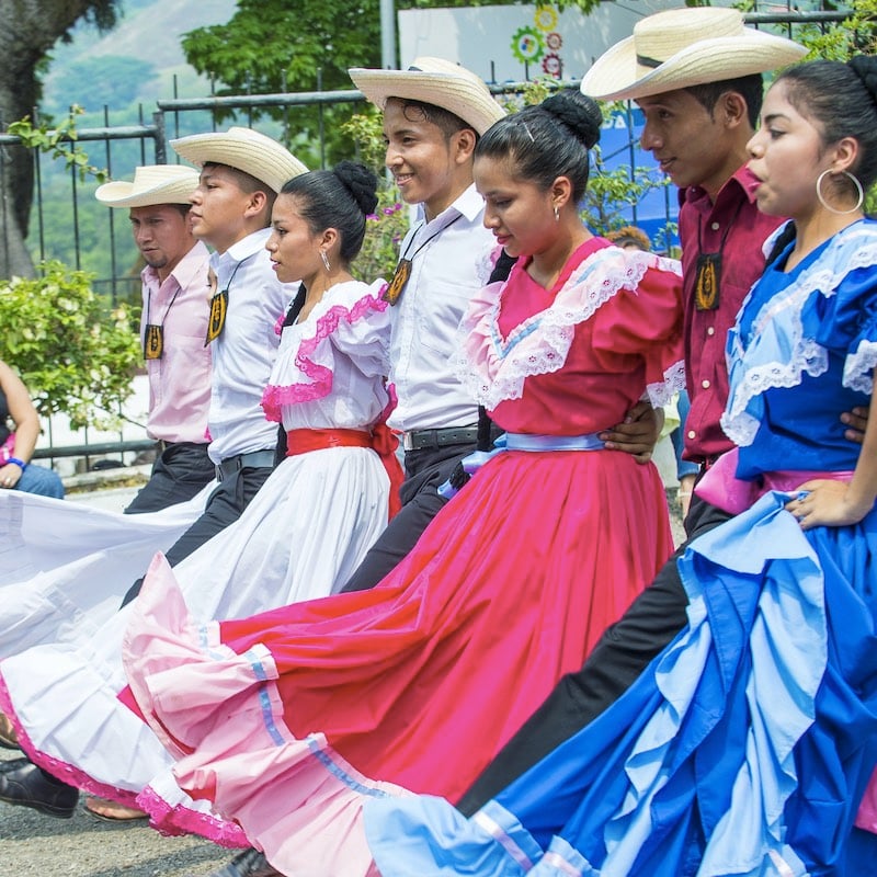 Salvadorian dancers perform during the Flower & Palm Festival in Panchimalco, El Salvador