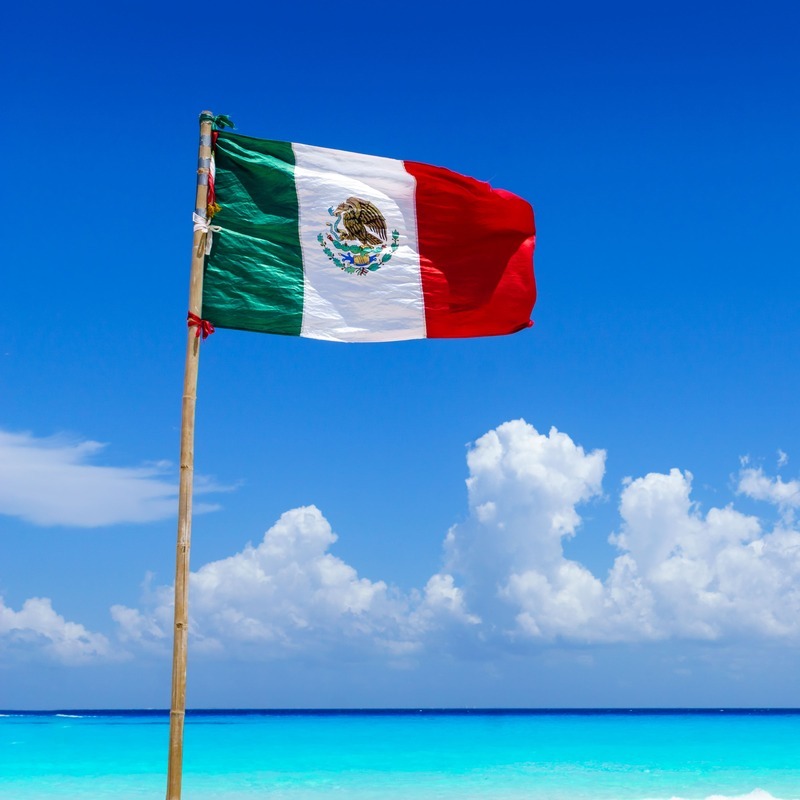 Mexican Flag Displayed Against A Tropical Sea Background, Mexican Caribbean, Riviera Maya, Mexico