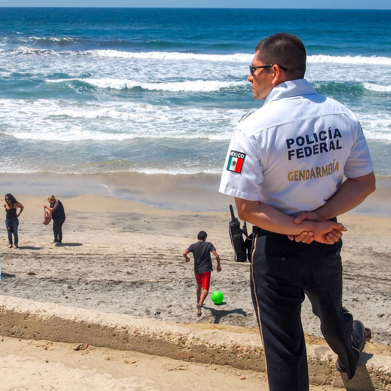 Mexican Police Officer Patrols Beach, Mexico