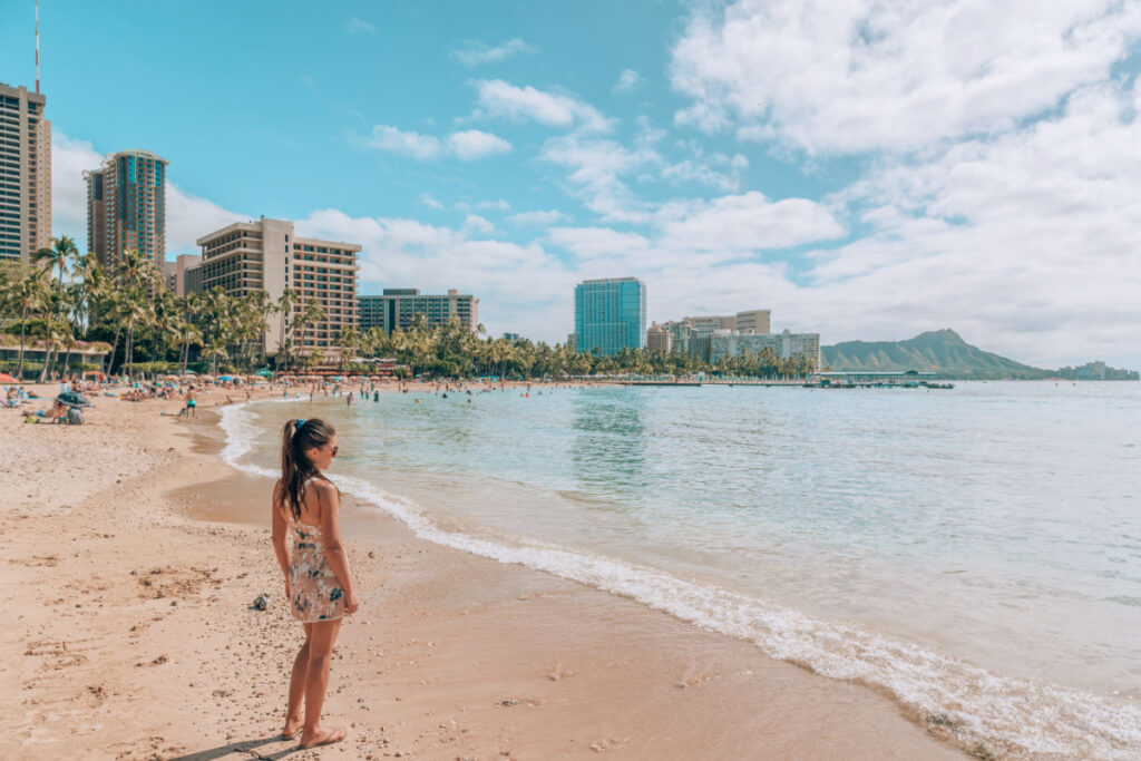 Tourist woman walking in Honolulu, Hawaii during winter holidays