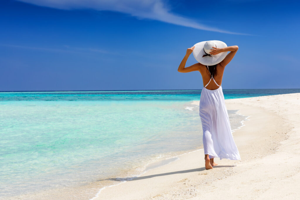 Woman Walking on the Beach in the Caribbean