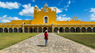 Young Female Tourist In The Yellow City Of Izamal, Yucatan Peninsula, Mexico