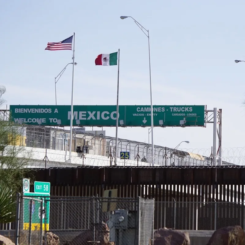 A Border Checkpoint Between Mexico And The United States Close To El Paso, Texas, Lined By Fences