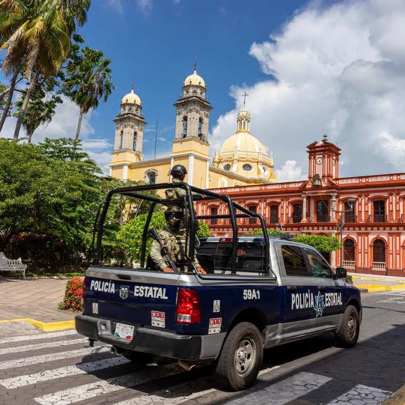 A Police Car Patrolling The Streets Of Colima, Mexico, Latin America