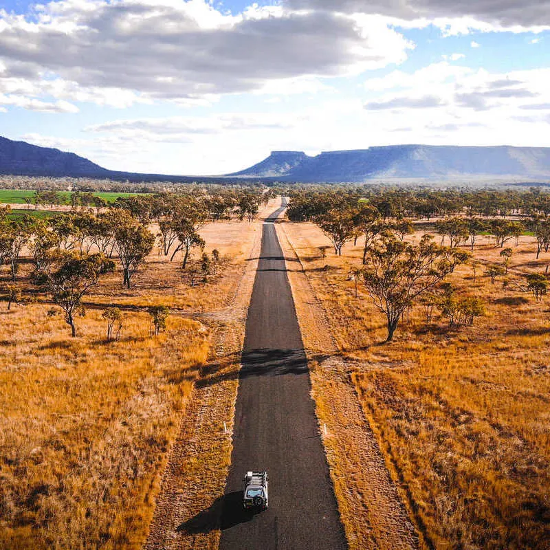 Aerial View Of A Car Driving Into The Outback, Australia