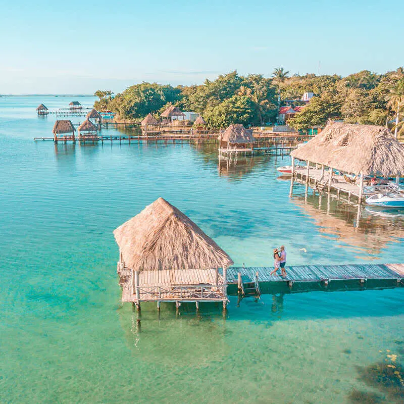 Aerial View Of A Couple Embracing On A Pier In Lake Bacalar, Southern Quintana Roo, Mexico