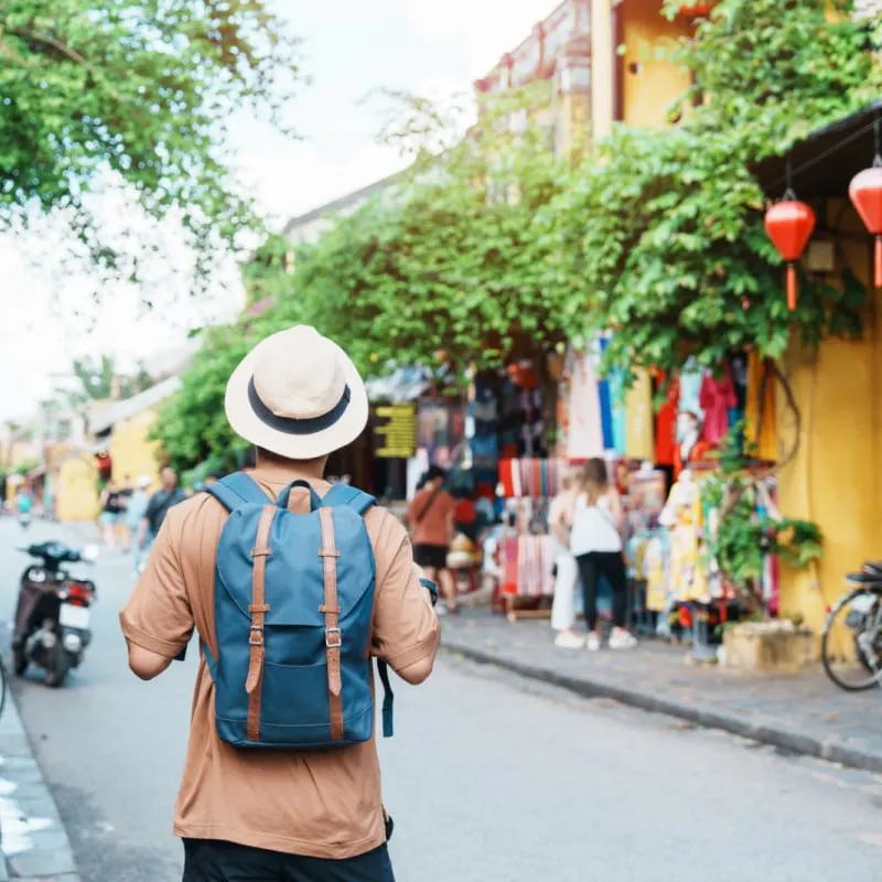 backpacker walking through city