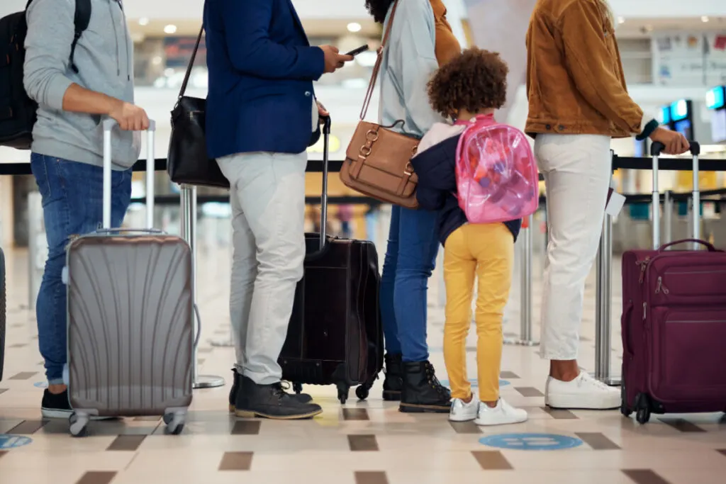 People waiting in line for airport security