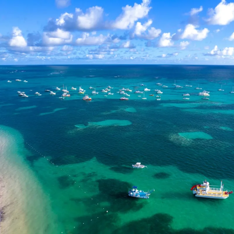 boats on blue water in punta cana