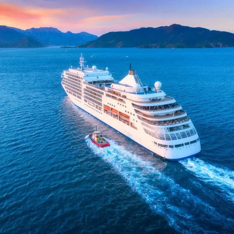 Cruise ship at harbor. Aerial view of beautiful large white ship at sunset.