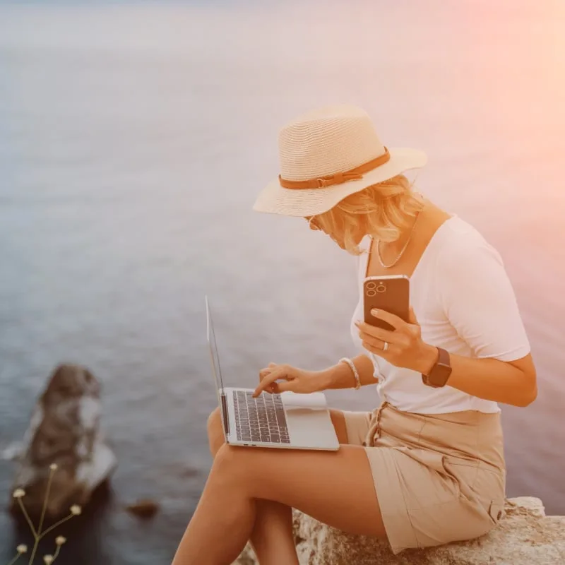 Digital Nomad Woman Working by the Sea