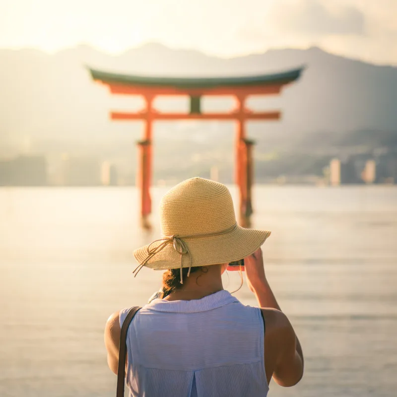 female tourist taking photo in japan