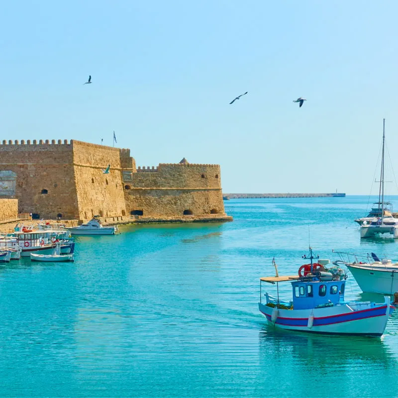 Harbour with fishing boats by the Koules Fortress in Heraklion, Crete, Greece