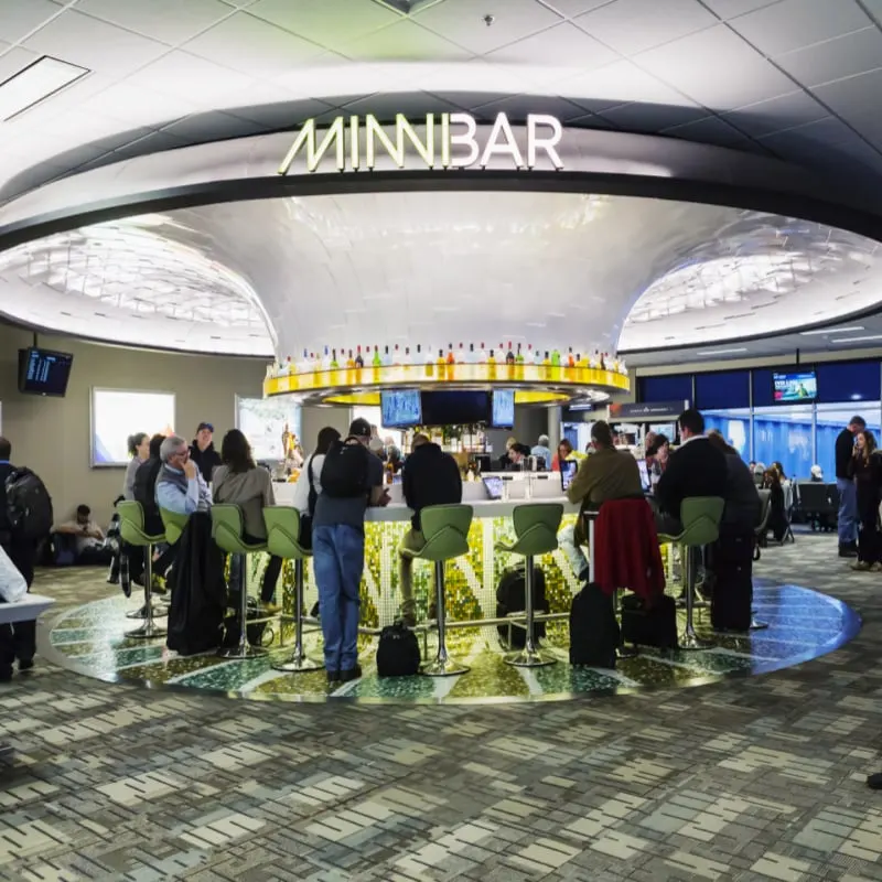 Minneapolis Airport interior in Minnesota. Passengers sitting at the bar