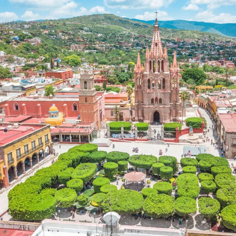 Jardin Allende with pink Gothic cathedral