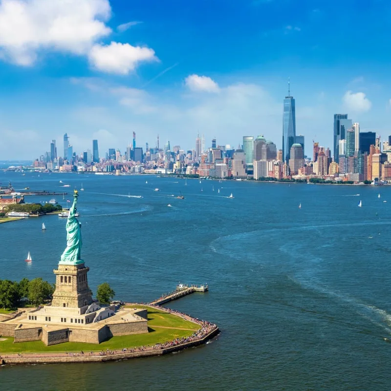 statue of liberty and new york skyline