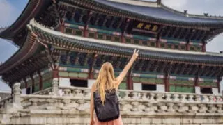 female solo traveler at korean palace