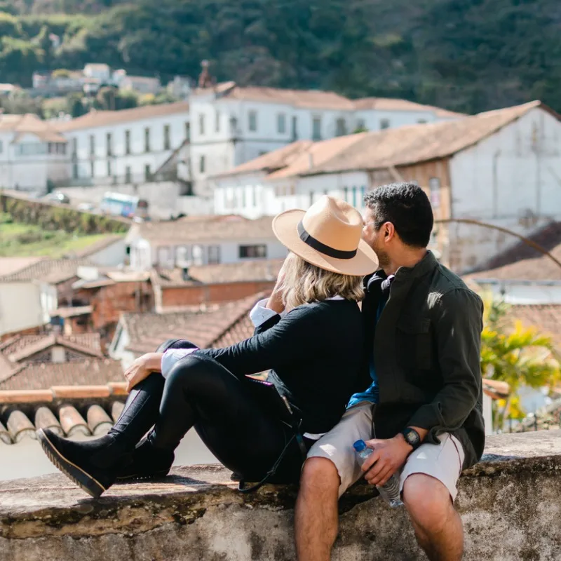 Tourist Couple Admiring The Historical City Of Ouro Preto, Minas Gerais, Brazil