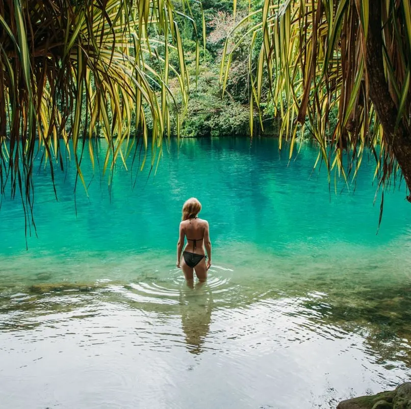 Woman in a blue lagoon in jamaica