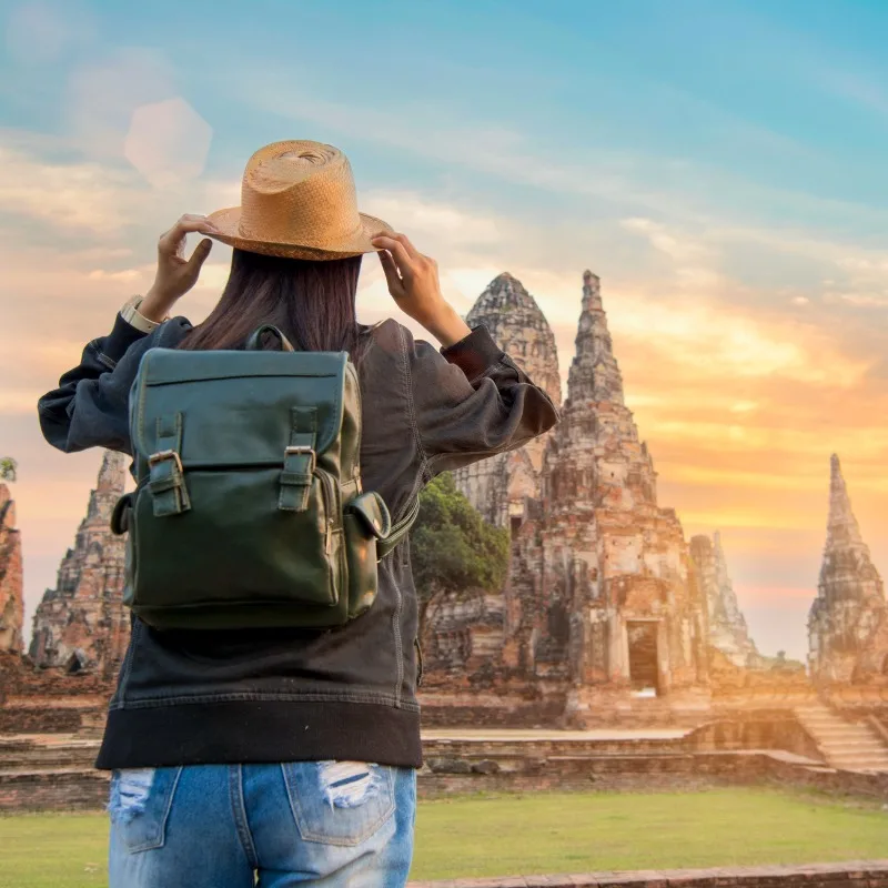 Young Traveler Gazing At Ayutthaya Historical Park, Thailand, Southeast Asia
