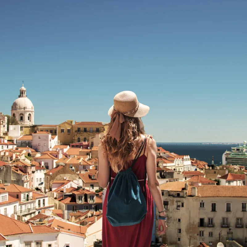 Young woman looking at Lisbon Panorama in Portugal